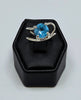 Sterling Silver Swirl Blue Topaz Solitaire Ring