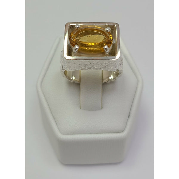 Oval Citrine sitting in Sterling Silver Ring