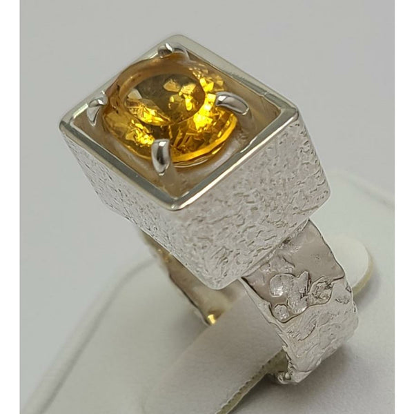 Oval Citrine sitting in Sterling Silver Ring