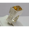 Oval Citrine sitting in Sterling Silver Ring