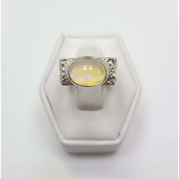 Opal sitting on bed of Sterling Silver Ring